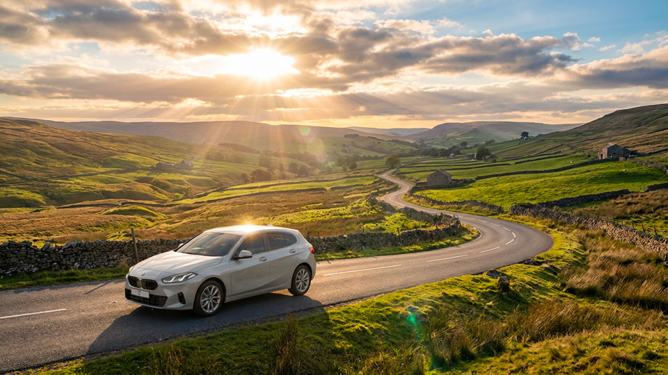 BMW 1 Series hatchback on a countryside road